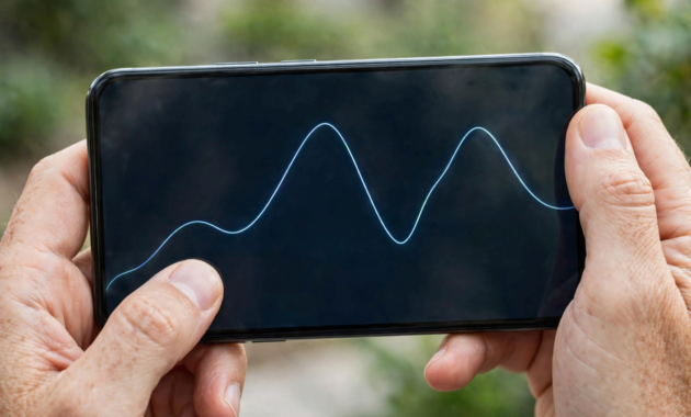 Close-up of a phone showing a stock chart while learning to start stock trading for beginners